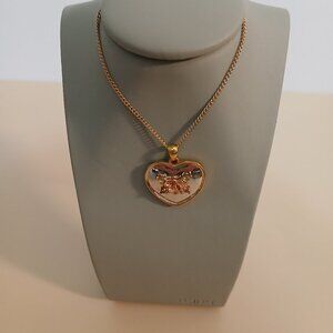 Pre-owned, showing very fine scratches on both sides.